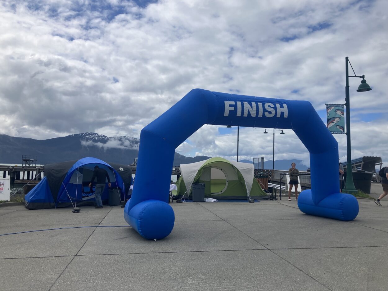 The finish line at the 2023 Tongass ToughMan Triathlon. There is an inflatable arch with the word "Finish" at the very top.