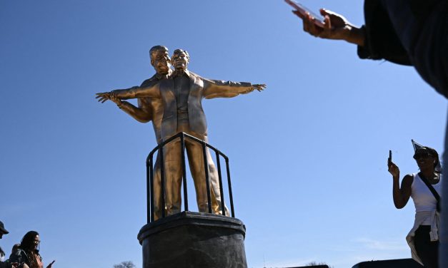 A propaganda war on the National Mall pits Trump against satirical statues and posters